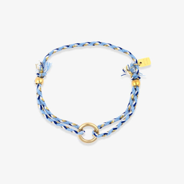 Blue braided bracelet with gold accents on a white background