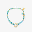 Blue braided bracelet with gold accents on a white background